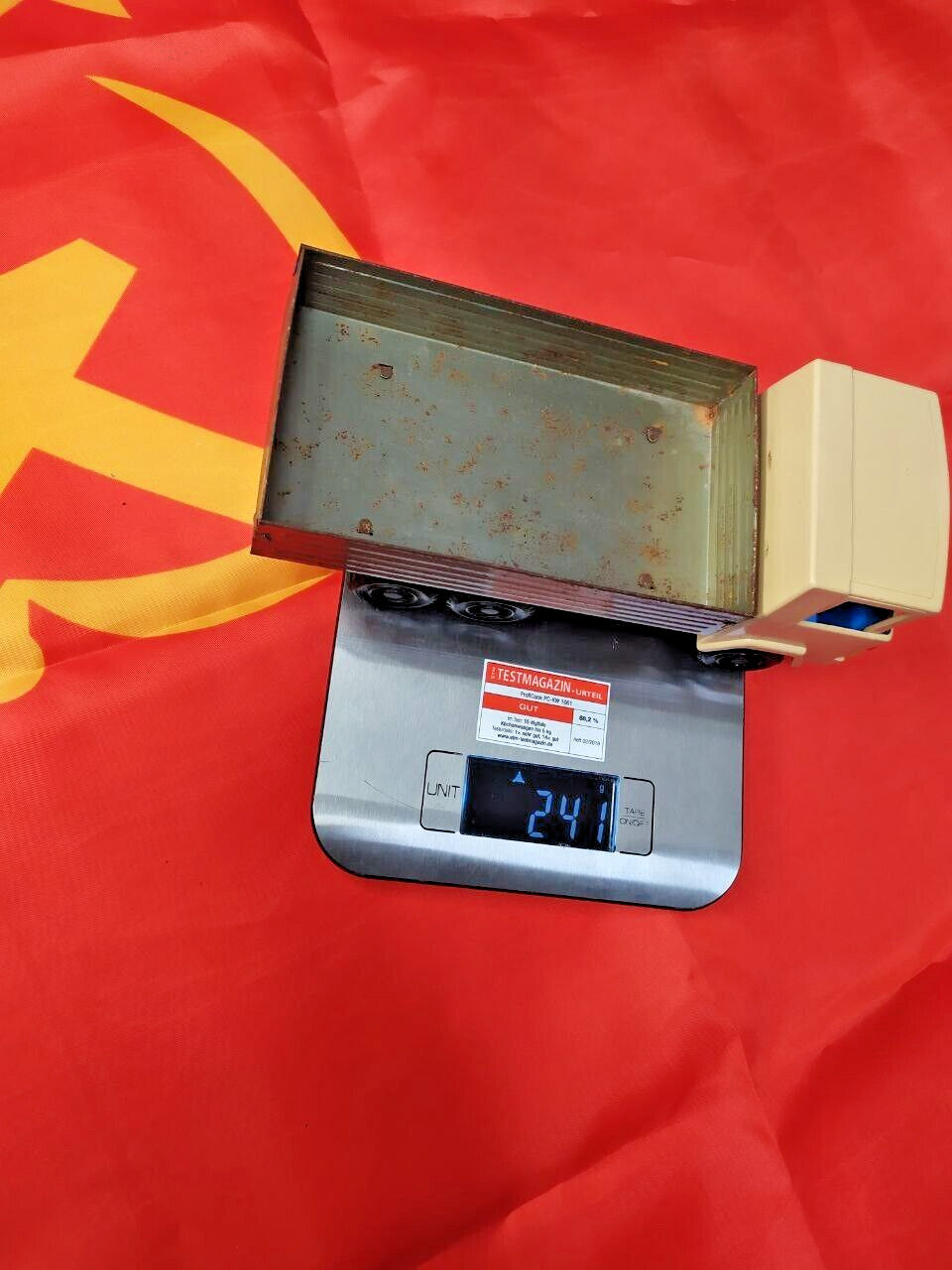 Old Soviet toy truck showing play wear, rust and paint loss on the tin bed – detail 11