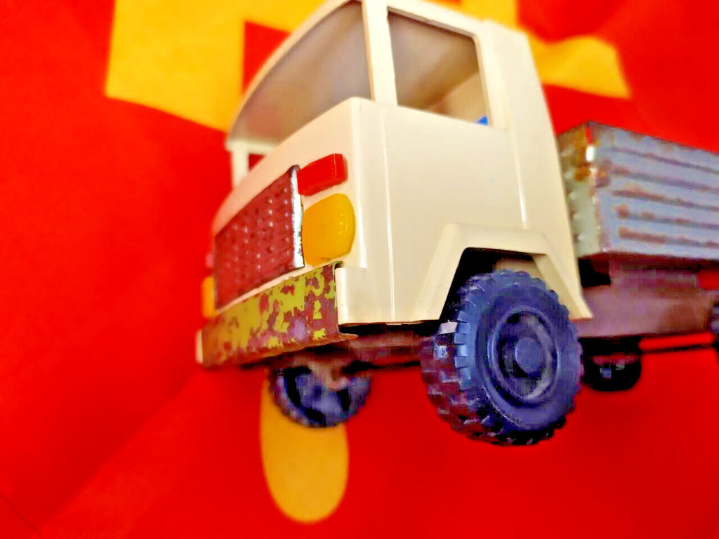 Three axles and wheels of the vintage Soviet tin toy cargo truck