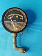 Soviet tire pressure gauge MD-214 with black metal body and curved nozzle
