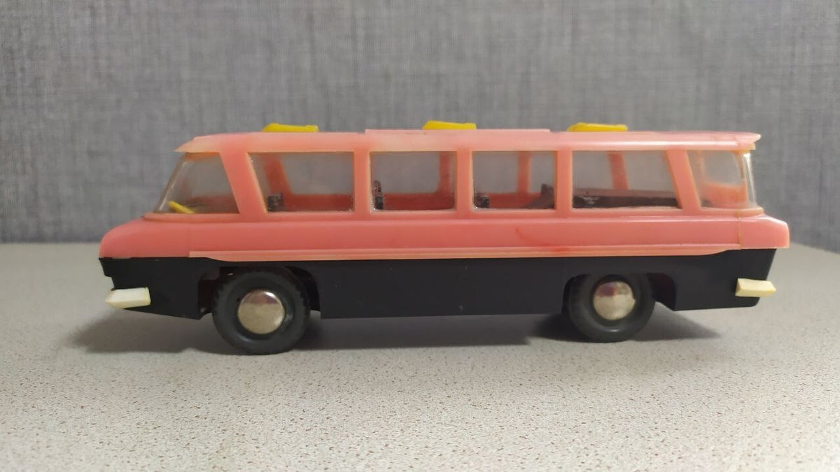 Vintage Soviet toy bus with wrap-around windshield and roof skylights