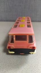 Interior seating visible through the windows of the MIR toy bus – detail 6