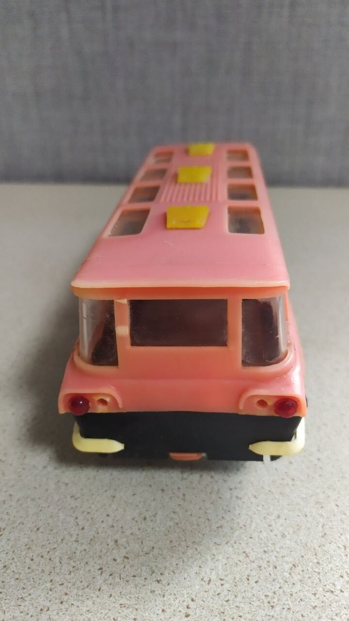 Interior seating visible through the windows of the MIR toy bus – detail 6