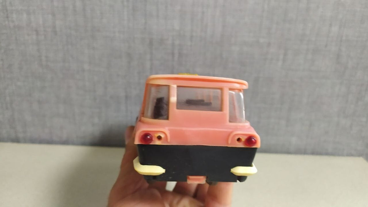 Interior seating visible through the windows of the MIR toy bus – detail 9