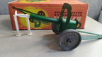 Vintage Soviet toys shooting metal cannon on plastic wheels