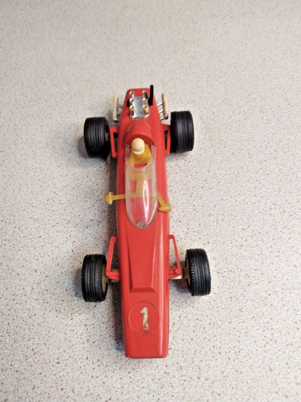 Vintage Soviet toy racing car with transparent cockpit cover and chrome engine