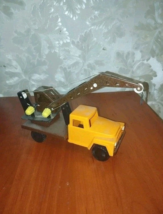 USSR toy cars: underside of crane truck showing wheels and metal frame