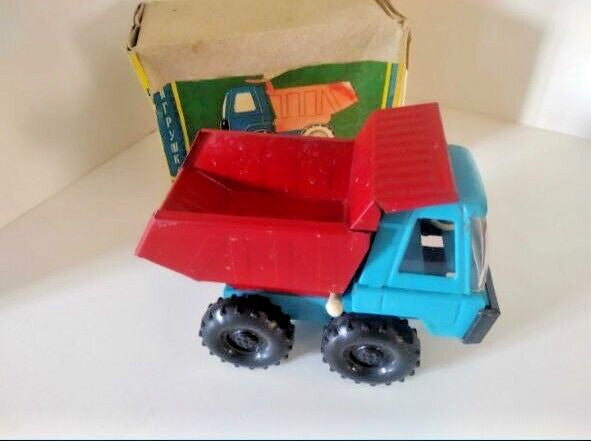 Soviet toy dump truck with blue plastic cab, red steel tipping bed and original box