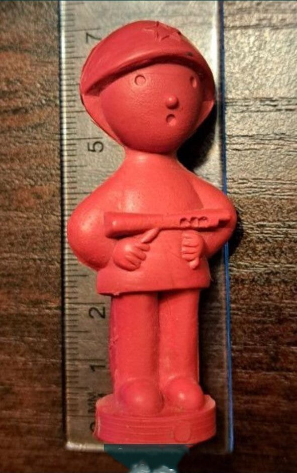 Vintage Soviet toy soldier in star helmet, front view