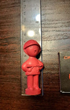 Price mark 10 kopecks on the base of the old Soviet rubber soldier