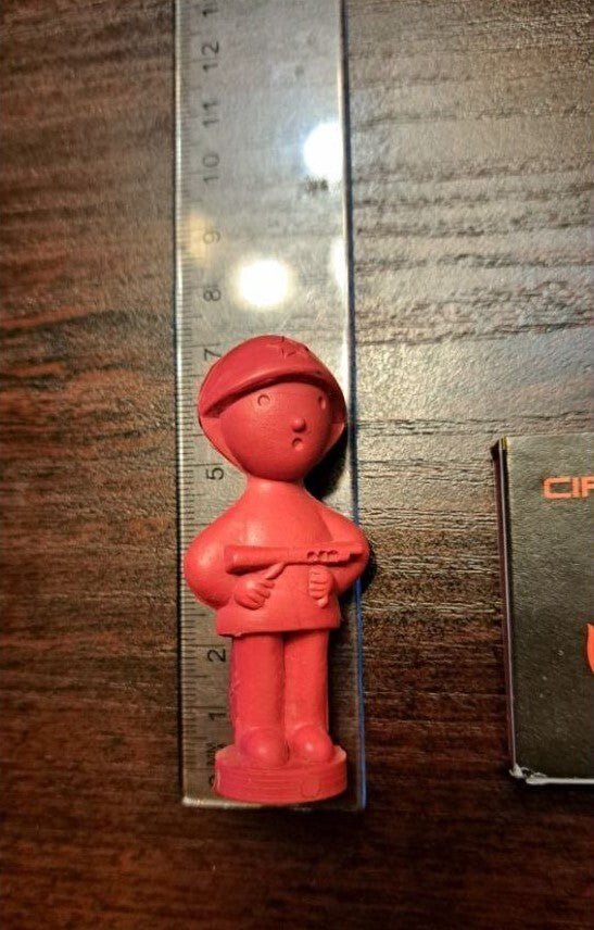 Price mark 10 kopecks on the base of the old Soviet rubber soldier