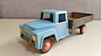 Vintage Soviet toy car with lithographed green pebble-pattern chassis