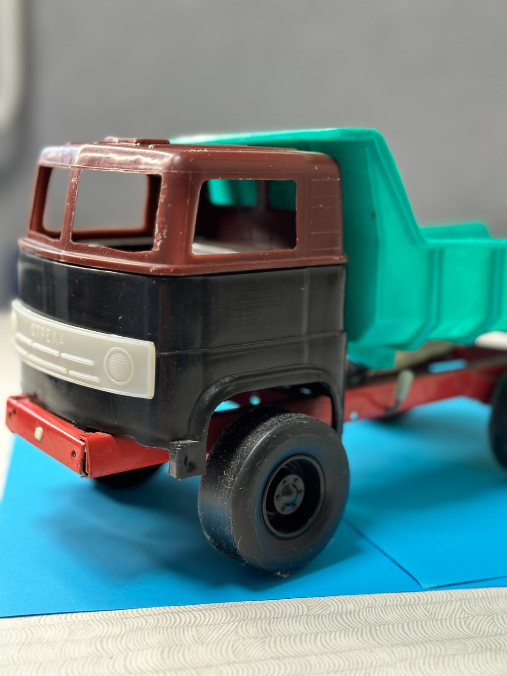 Soviet toy truck Strela dump truck with green plastic body and red metal chassis