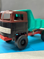 Red steering wheel inside the cab of the USSR toy truck