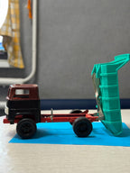 Red steering wheel inside the cab of the USSR toy truck – detail 7