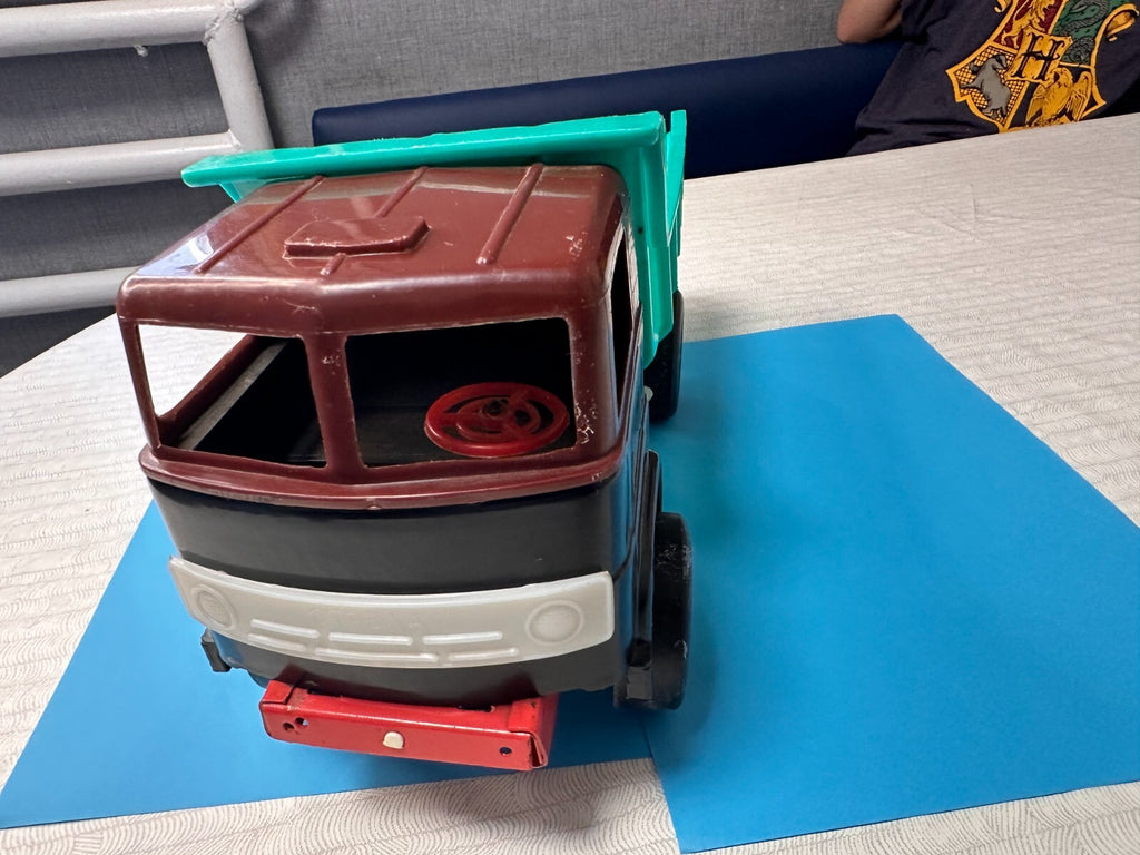 Strela logo on the white front grill of the vintage Soviet toy truck – detail 8