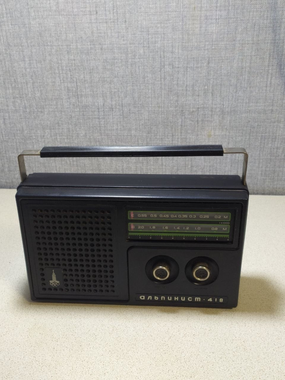 Soviet transistor radio Alpinist 418 with 1980 Moscow Olympics logo on the grille