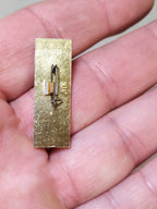 Back of a gold-tone Soviet anniversary pin