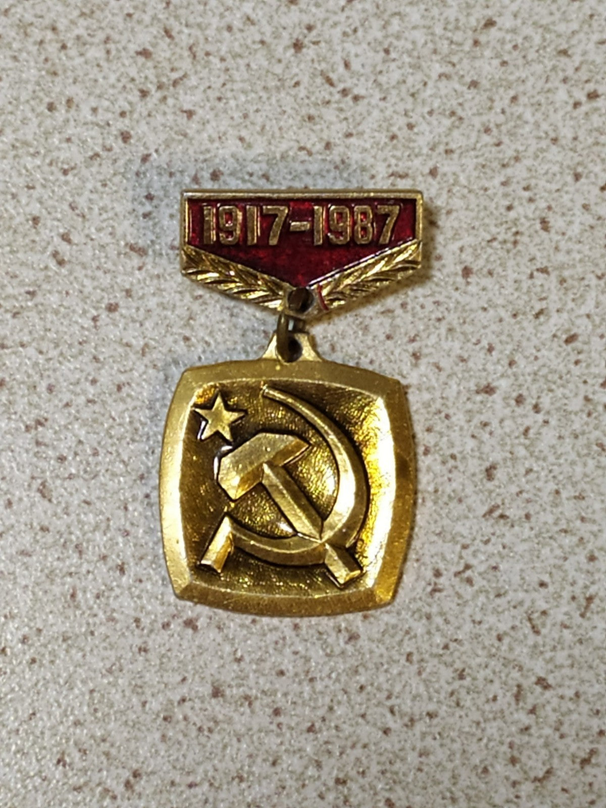 Soviet jubilee pin dated 1917-1987 front view