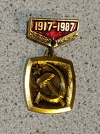 Vintage USSR 70th anniversary badge on plain background