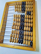Vintage Soviet abacus, close-up of wooden beads and patina on the frame