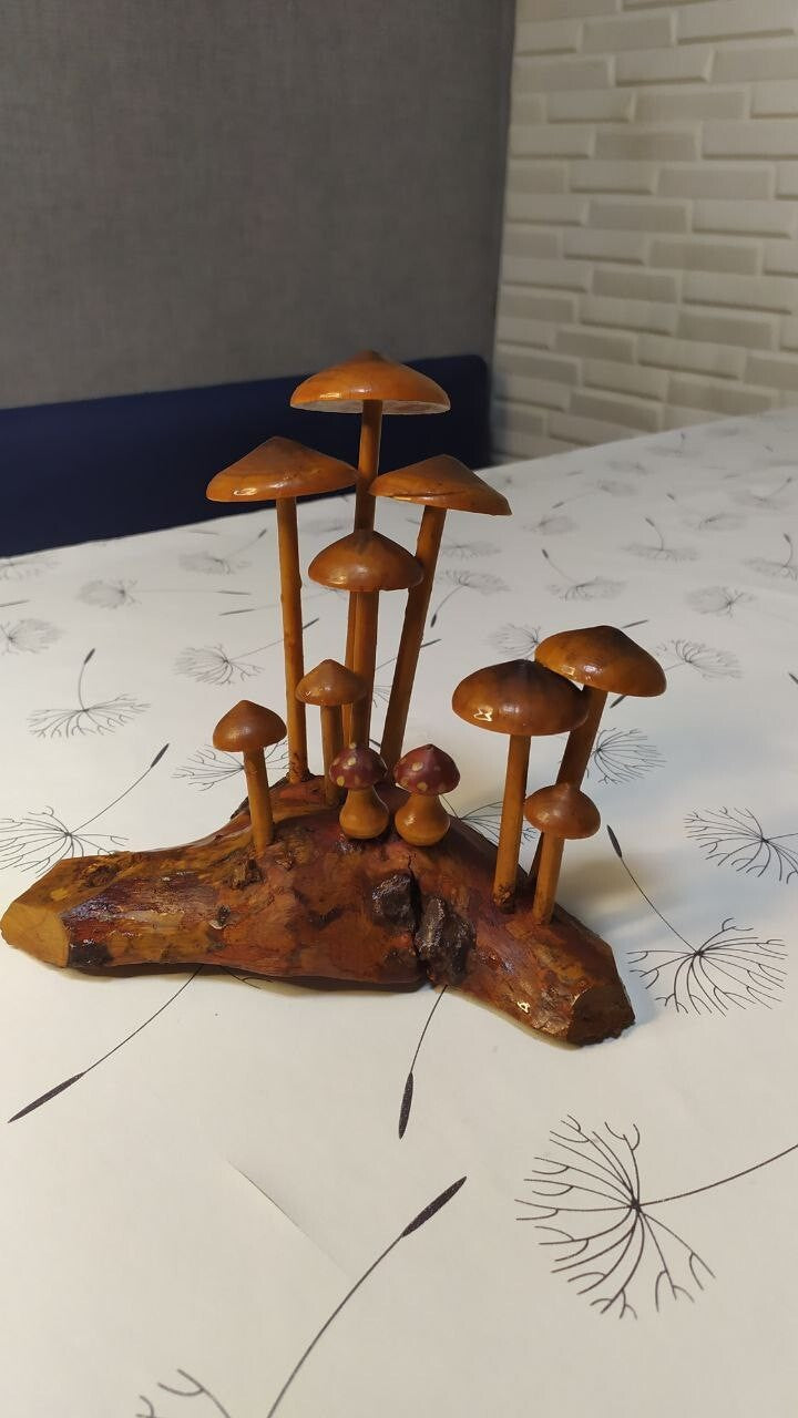 Soviet wooden mushroom figurine in Forest Plastic style on a natural wood base