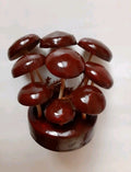 Soviet wooden mushroom figurine with glossy lacquered brown caps on a wooden base