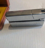 Vintage Soviet pocket lighter ZG20 in its brown case with yellow velour lining