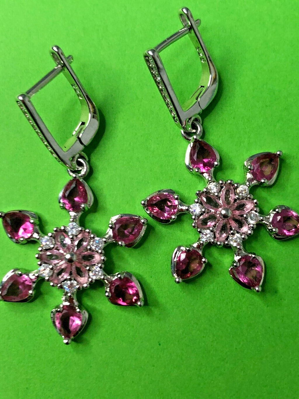 925 silver earrings with round center stone and six pear-cut pink stones