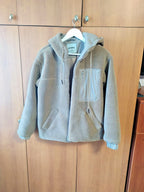 Kids teddy coat laid flat with measuring tape across the chest – detail 6