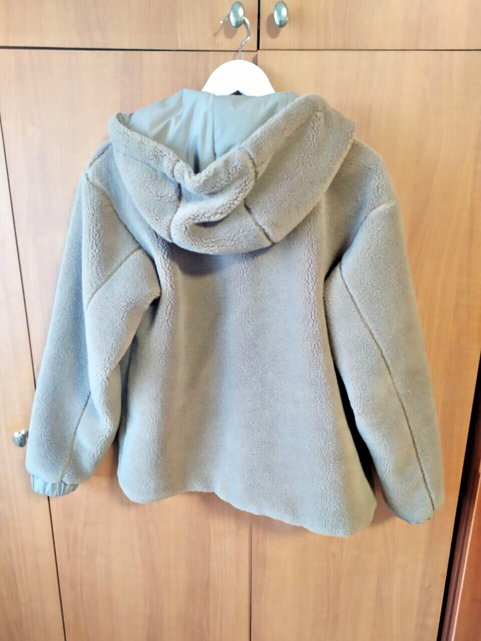 Kids teddy coat laid flat with measuring tape across the chest – detail 9