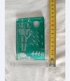 Teal home decor glass panel set into a removable clear stand