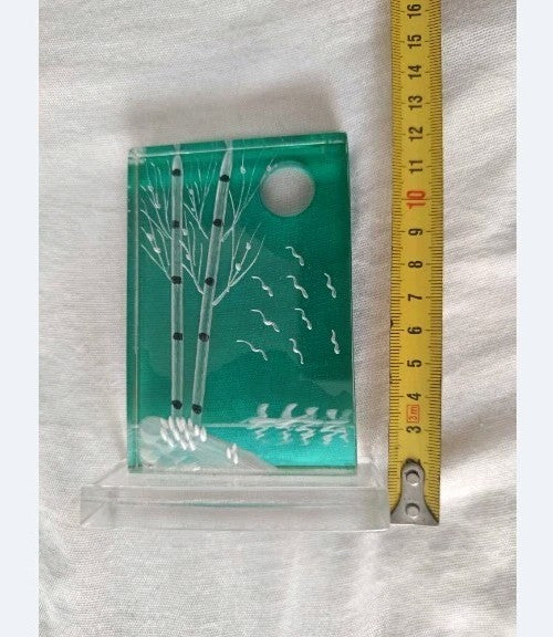 Teal home decor glass panel set into a removable clear stand