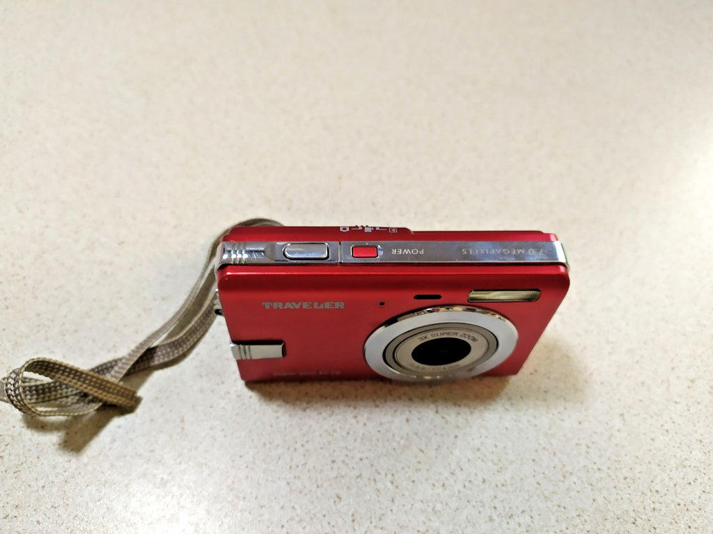 LCD screen with black dots on the red compact digital camera