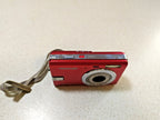 LCD screen with black dots on the red compact digital camera