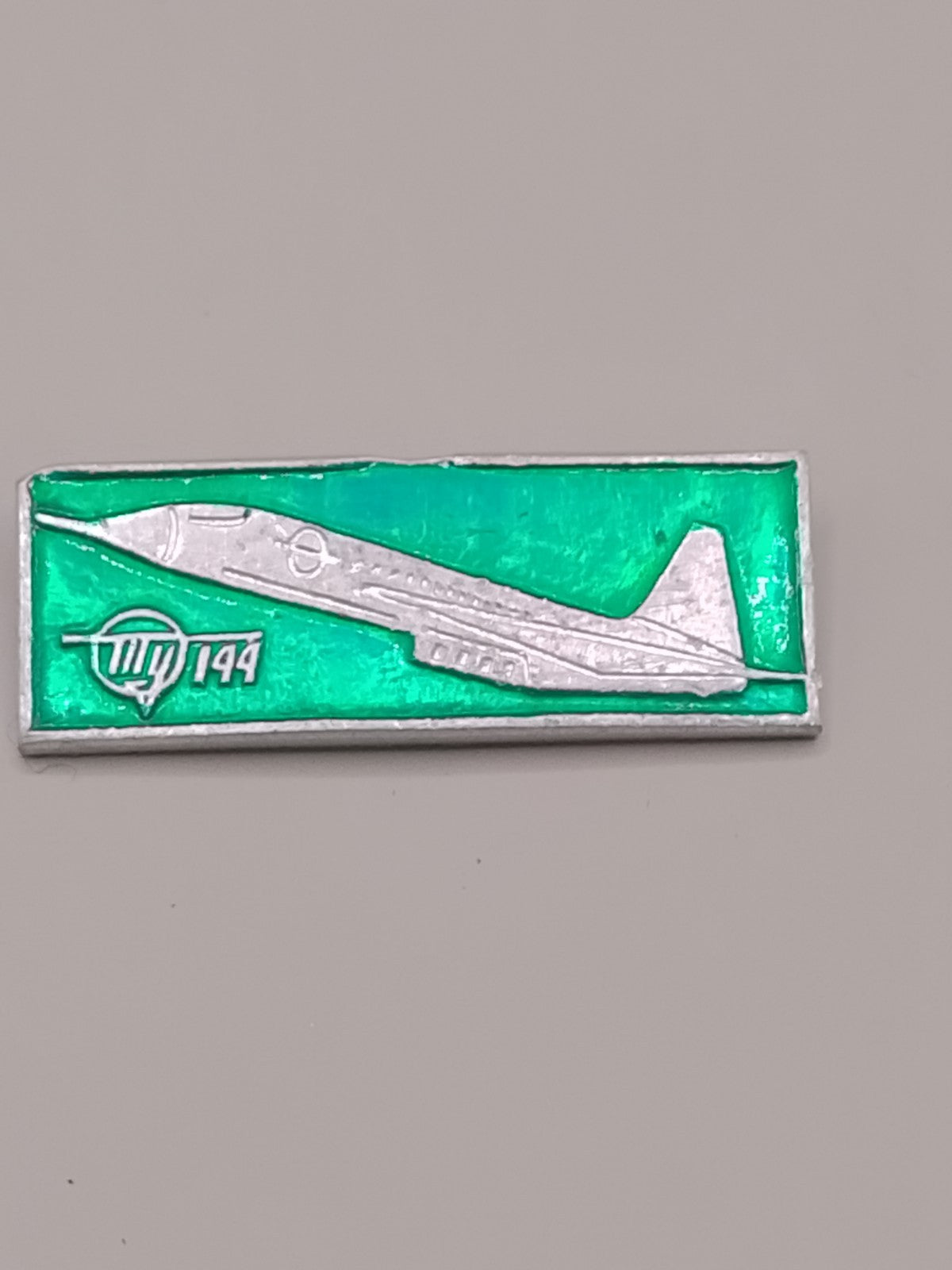 Tu-144 Soviet supersonic airliner pin badge in green enamel, vintage USSR