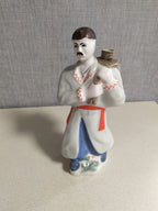 Ukrainian Cossack porcelain decanter shaped as a Kozak in vyshyvanka and blue sharovary