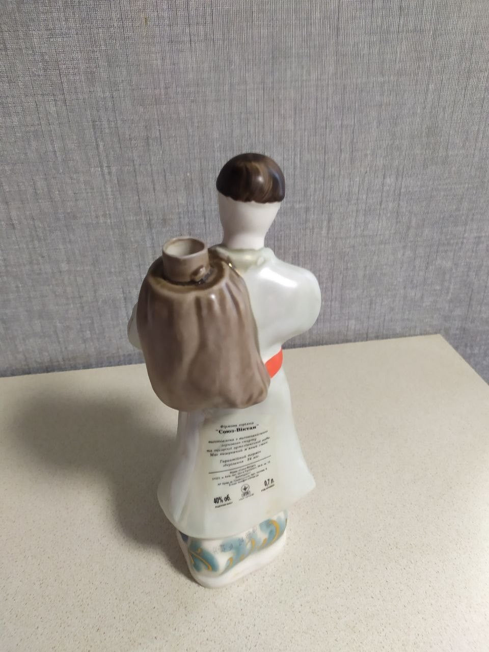 Korosten porcelain Kozak figurine bottle with sack on his back
