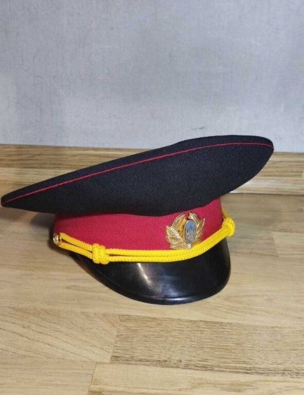 Ukrainian militia visor cap in dark blue with red band and Tryzub metal cockade
