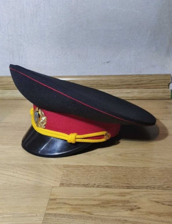 Metal cockade with the Ukrainian coat of arms on the police peaked cap