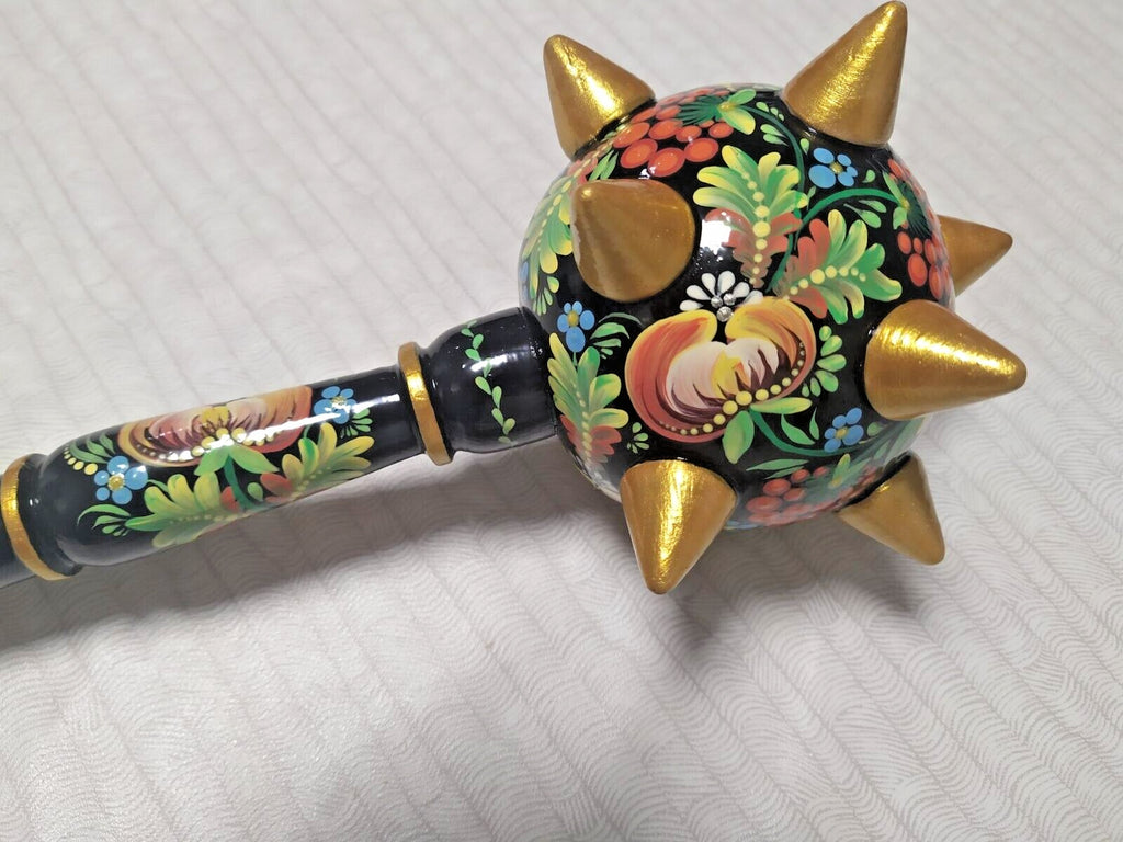 Petrykivka floral painting on a Ukrainian wooden bulawa mace