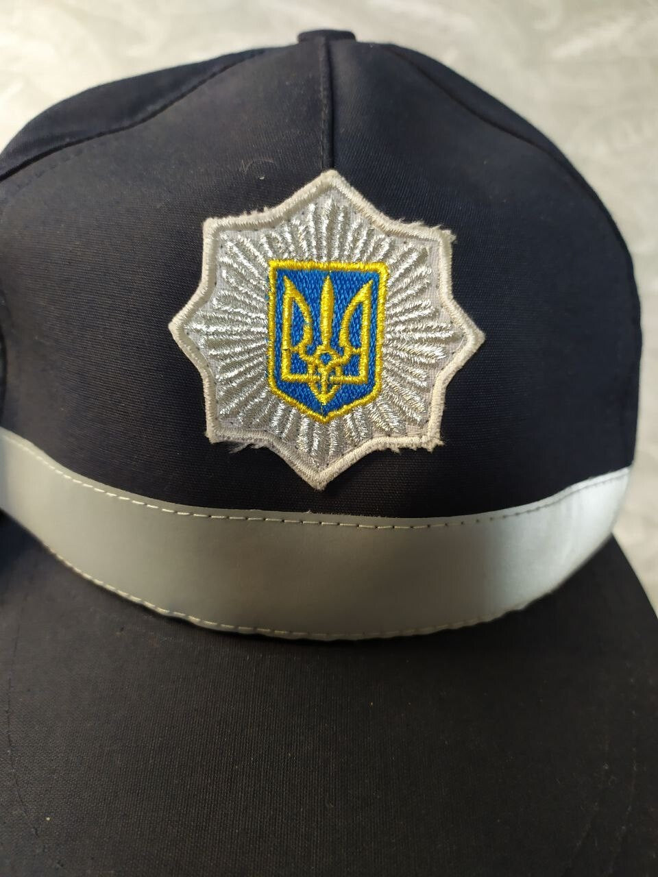 Embroidered silver star with Tryzub on the National Police of Ukraine cap – detail 5
