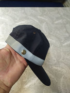 Reflective grey band around the crown of the police uniform hat – detail 6