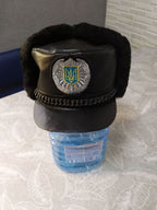 Embroidered Tryzub patch with silver-tone wreath on the winter uniform hat – detail 5