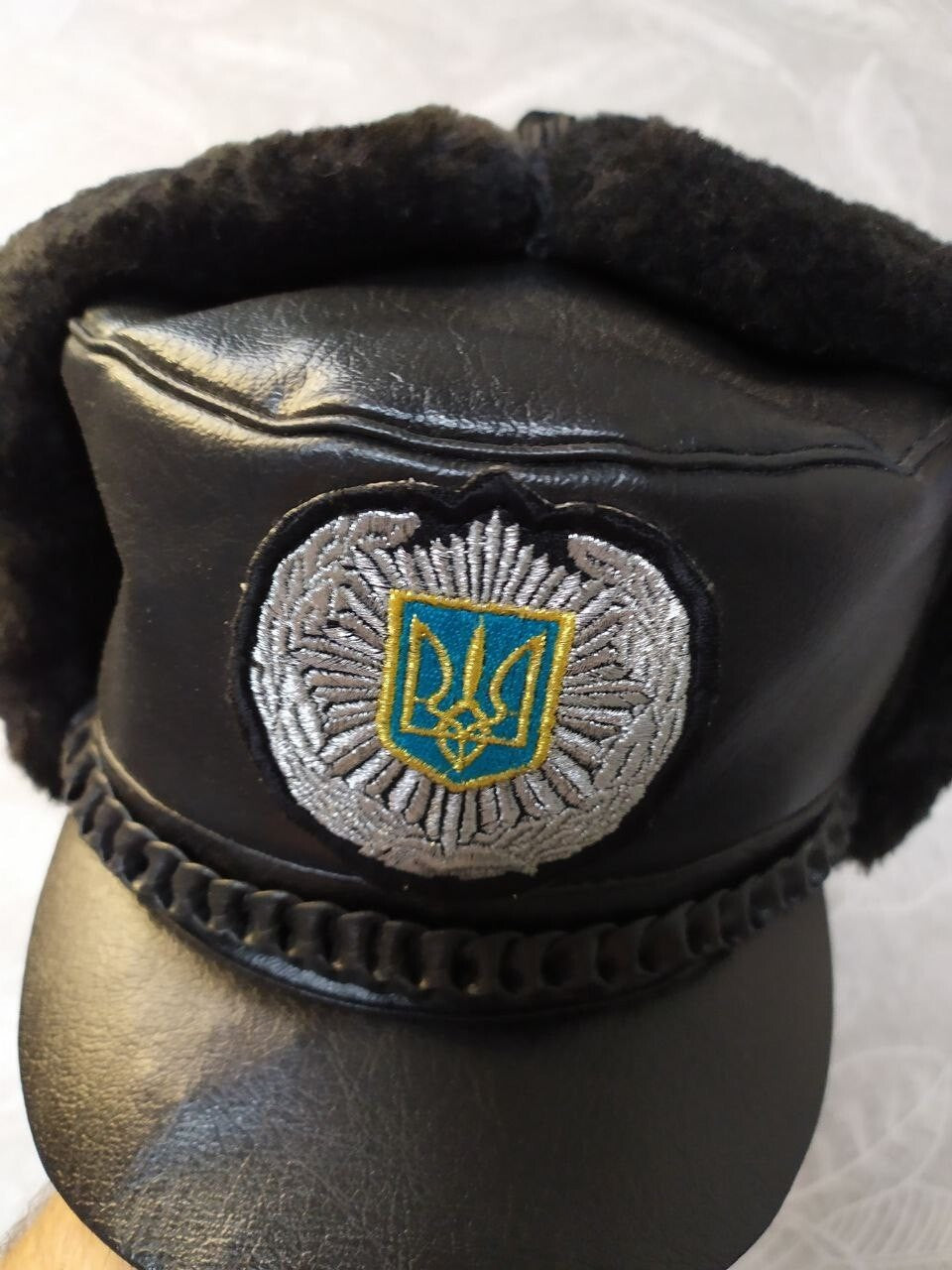 Inner size 54 tag of the black ushanka style cap – detail 7