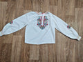 Ukrainian vyshyvanka blouse in white with multicolor floral and geometric embroidery