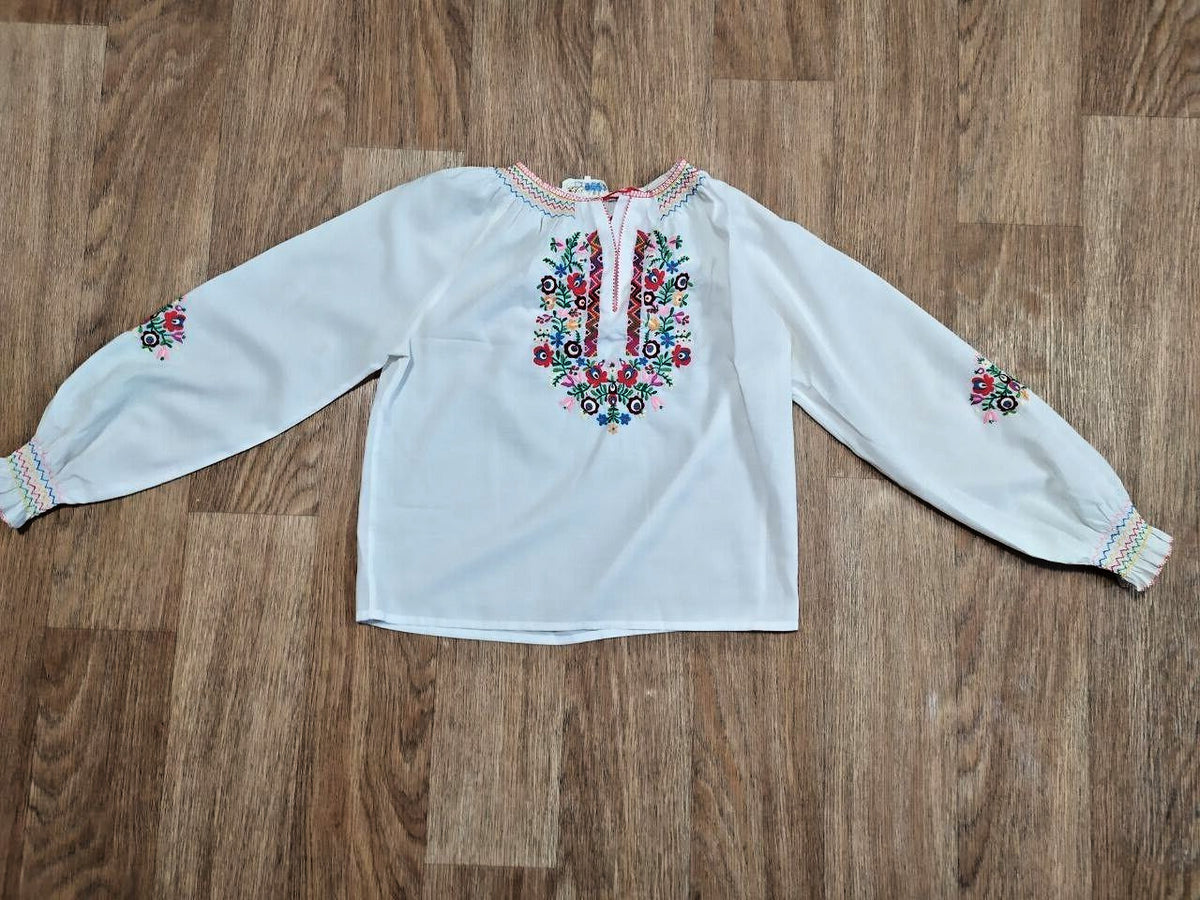 Ukrainian vyshyvanka blouse in white with multicolor floral and geometric embroidery
