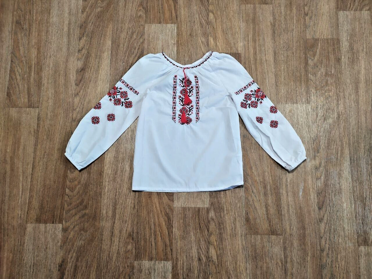 Cross-stitch folk embroidery on the vyshyvanka sleeves