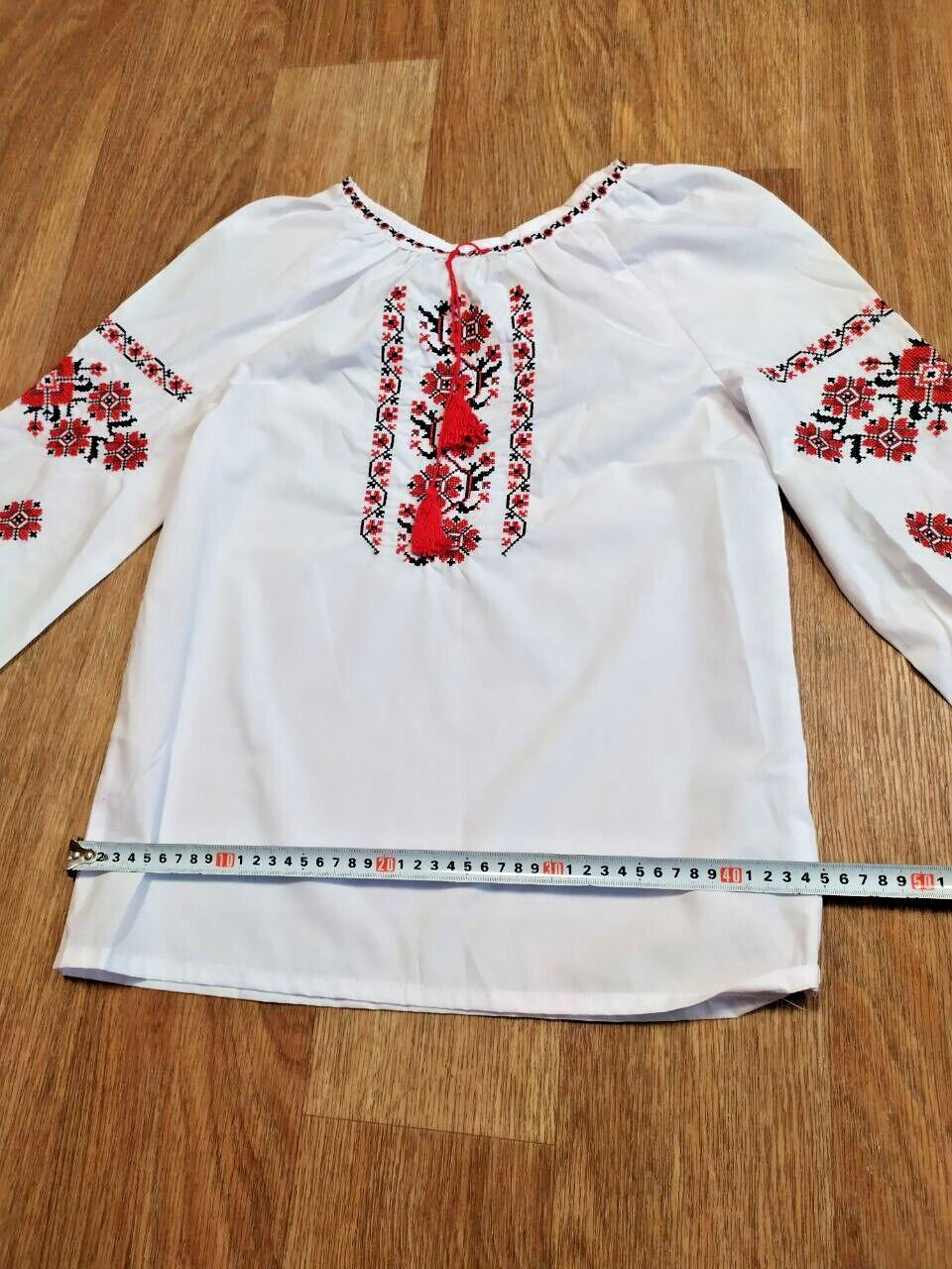 Cross-stitch folk embroidery on the vyshyvanka sleeves – detail 6