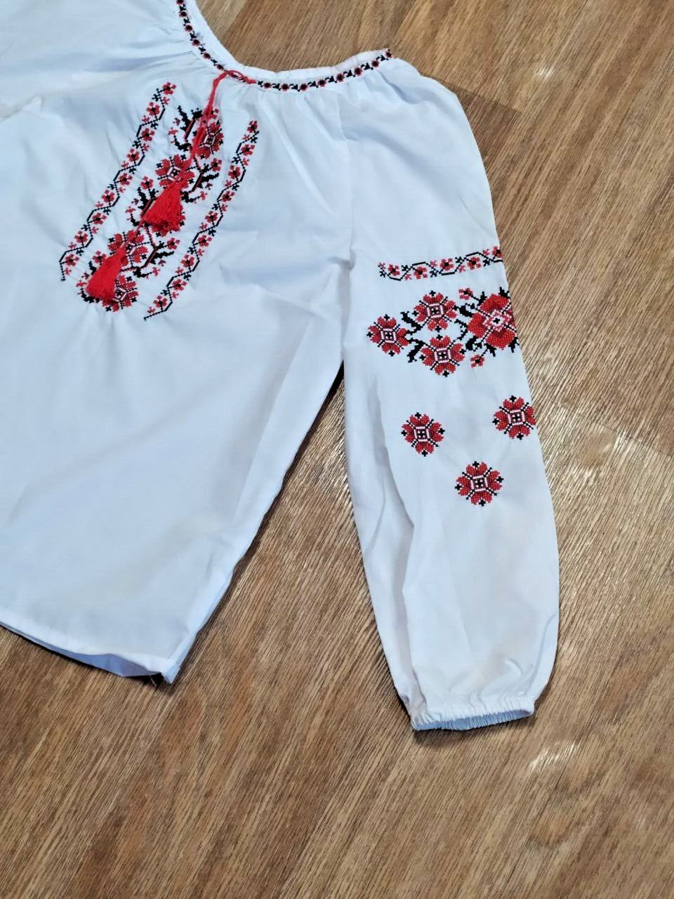 Cross-stitch folk embroidery on the vyshyvanka sleeves – detail 9