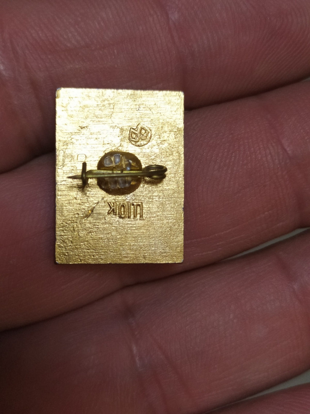 Old enamel Soviet anniversary pin close-up